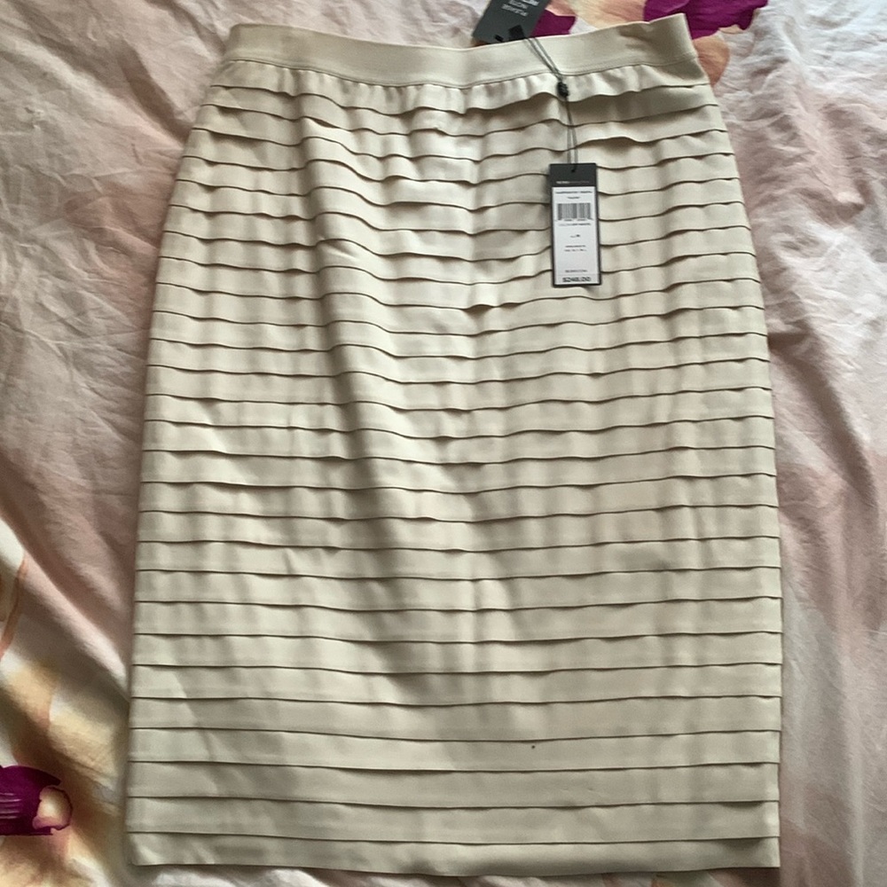 BCBGMaxazria off white skirt tagged as women’s size M